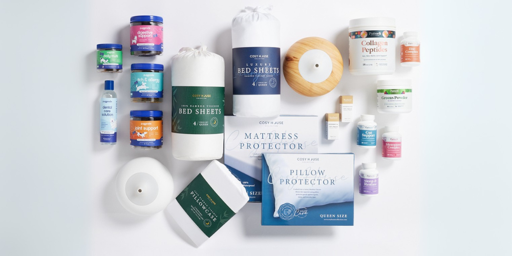 Wholesome Goods wellness products, supplements, and Cosy House bedding arranged on a white background.